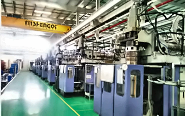 Line of blue blow molding machines in a customer workshop