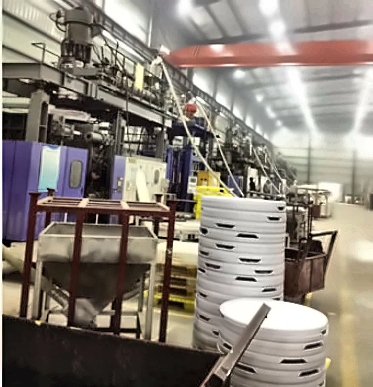 Blow molding line producing round hollow panels in a customer plant