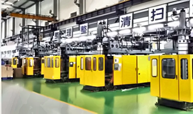 Row of yellow blow molding machines in a customer workshop