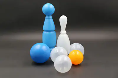 Plastic bowling pins and ball for a toy set