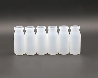 Row of white plastic bottles