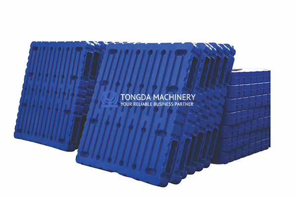 Stack of blue plastic pallets