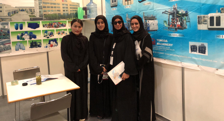 Three attendees at an exhibition