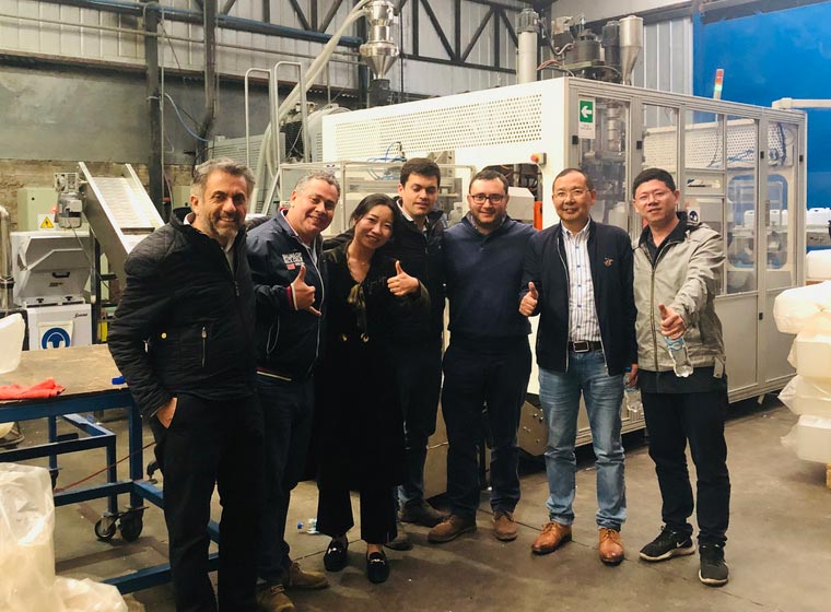 Visitor group in a machinery workshop